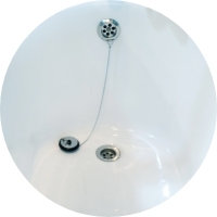 A  photo of a bathtub with drain stopper