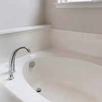 Photo of white and clean bathtub