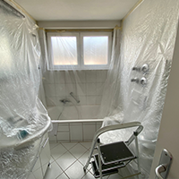 Photo of a bathroom covering plastic all other surfaces