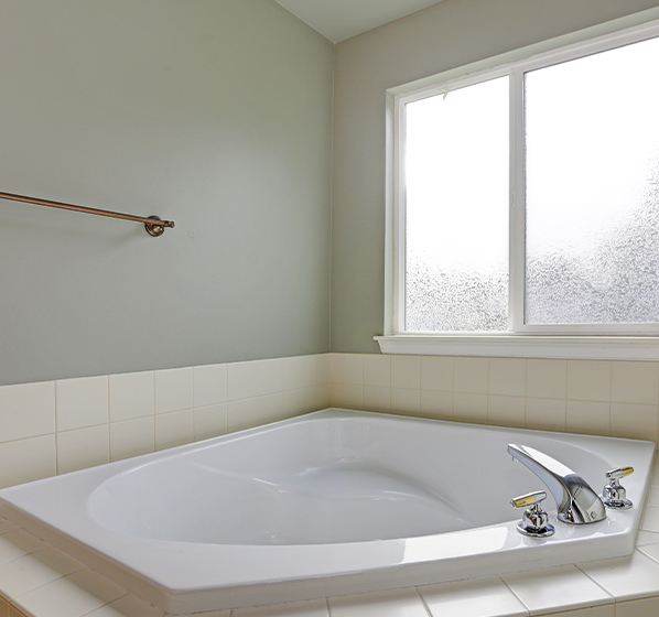 A photo of a beautiful white bathtub
